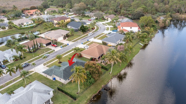 birds eye view of property featuring a water view