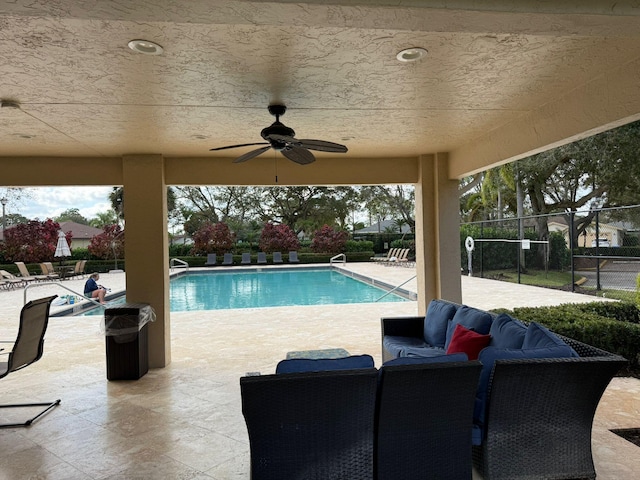 view of swimming pool featuring an outdoor hangout area, ceiling fan, and a patio area