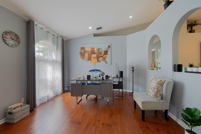 home office featuring lofted ceiling and wood-type flooring