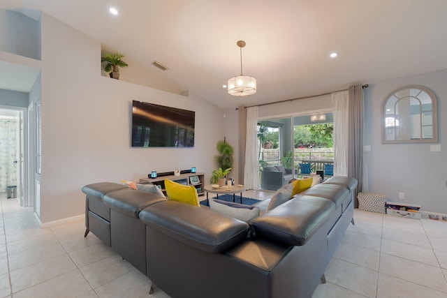 living room featuring vaulted ceiling and light tile patterned flooring