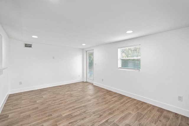 unfurnished room featuring light hardwood / wood-style floors