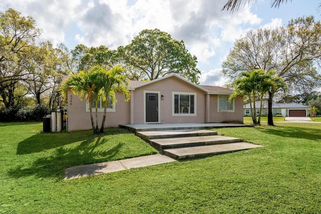 ranch-style house with a front lawn