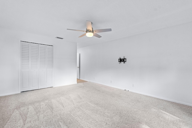 interior space with ceiling fan