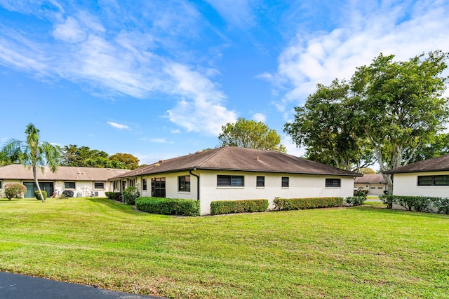 view of property exterior featuring a lawn