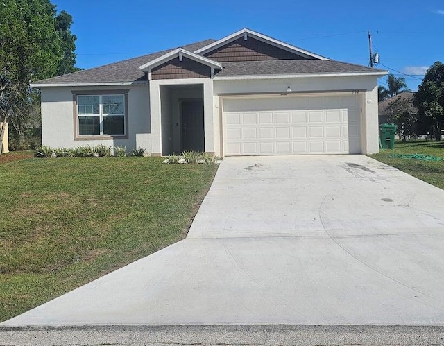 view of front of house with a garage and a front yard