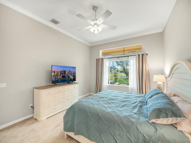 carpeted bedroom with crown molding and ceiling fan