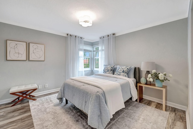 bedroom featuring hardwood / wood-style flooring