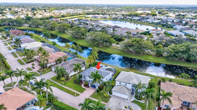 birds eye view of property with a water view