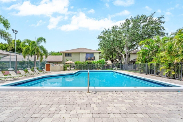 view of swimming pool featuring a patio area