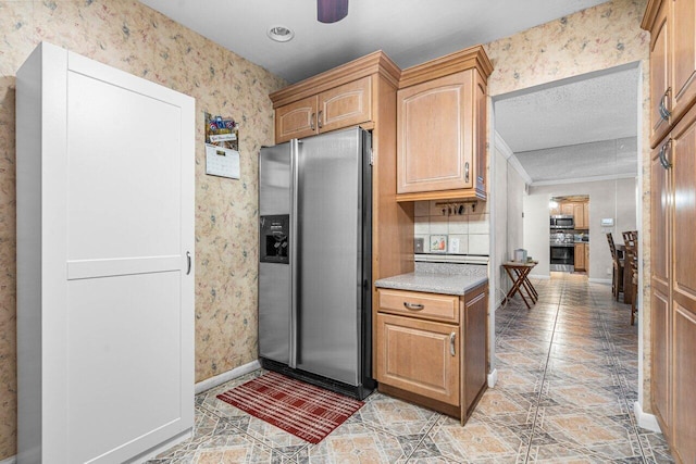 kitchen featuring appliances with stainless steel finishes and ceiling fan