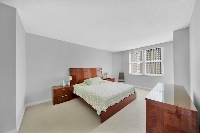 bedroom featuring light colored carpet