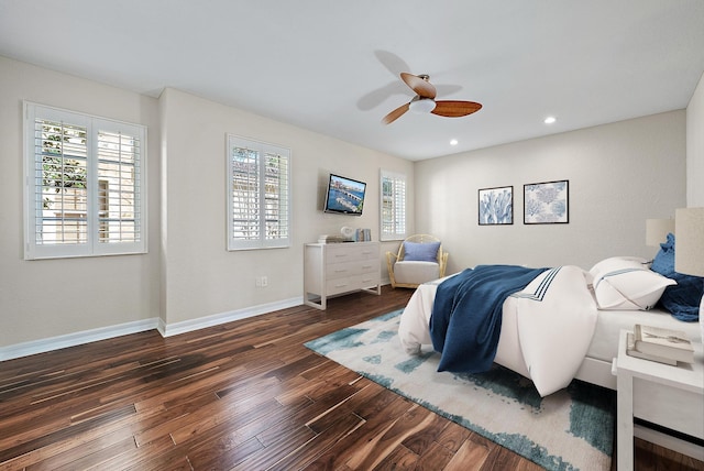 bedroom featuring ceiling fan and dark hardwood / wood-style floors