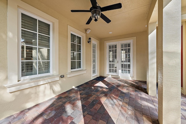 view of patio with french doors and ceiling fan