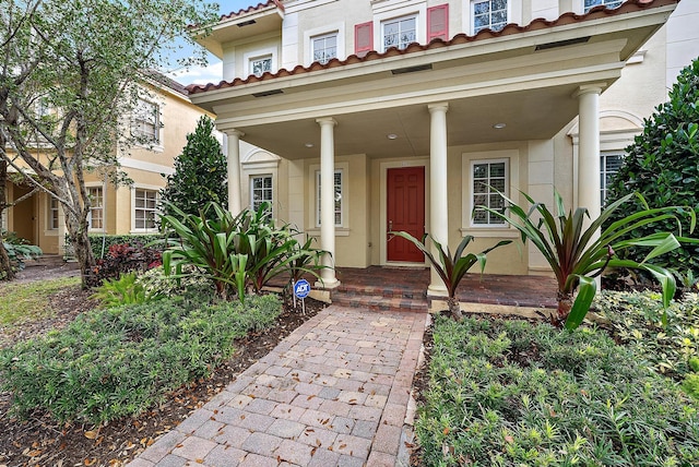 doorway to property with covered porch