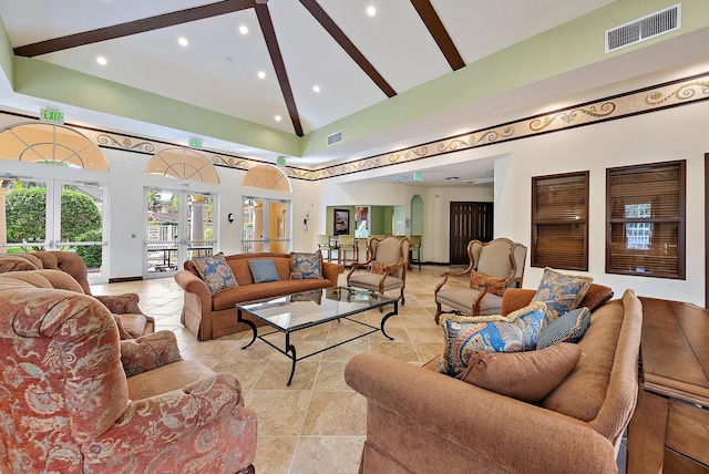 living room featuring french doors, high vaulted ceiling, and beam ceiling