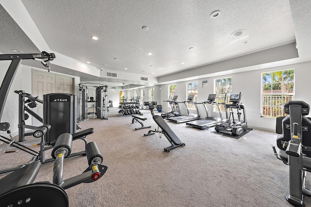 gym with a textured ceiling