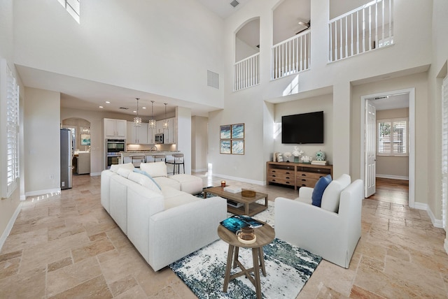 living room with a high ceiling