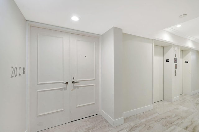 5080 N Ocean Dr Unit 20C, Riviera Beach, FL 33404 - hallway featuring baseboards, elevator, recessed lighting, and light marble finish floors