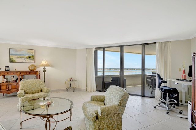 living room featuring light tile patterned flooring, ornamental molding, and floor to ceiling windows