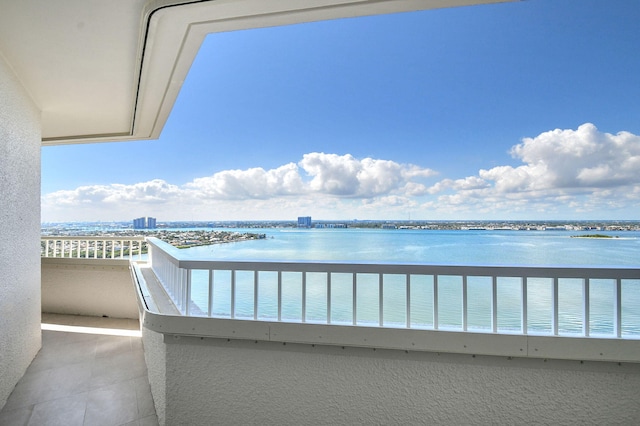 balcony featuring a water view