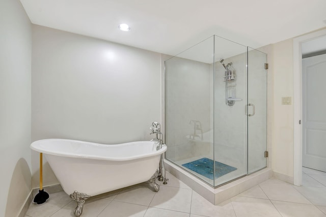 bathroom featuring shower with separate bathtub and tile patterned flooring