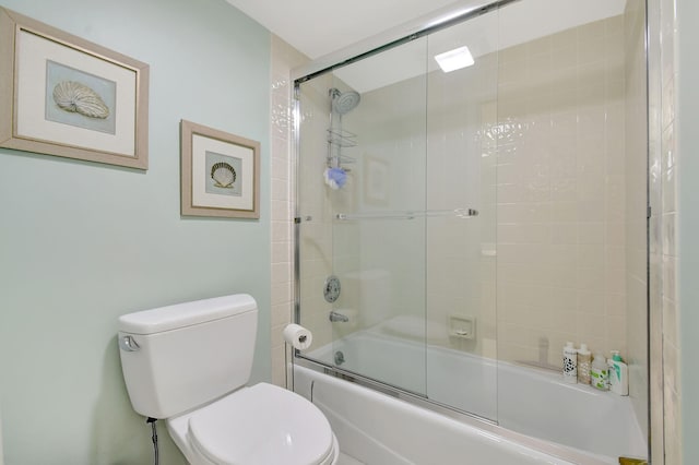 5080 N Ocean Dr Unit 20C, Riviera Beach, FL 33404 - full bathroom featuring toilet and shower / bath combination with glass door