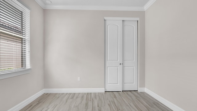 interior space featuring ornamental molding and light hardwood / wood-style floors