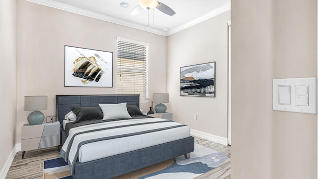 bedroom featuring ornamental molding, ceiling fan, and light wood-type flooring