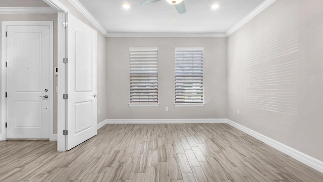 foyer featuring crown molding, ceiling fan, and light hardwood / wood-style floors