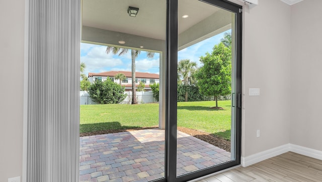 doorway to outside featuring light wood-type flooring