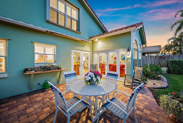 view of patio terrace at dusk