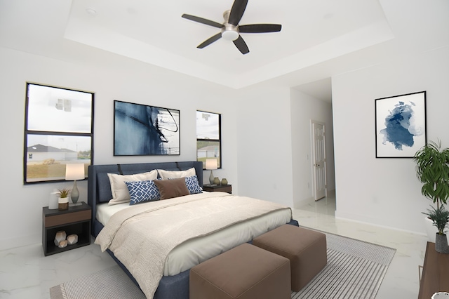 bedroom featuring marble finish floor, ceiling fan, baseboards, and a raised ceiling