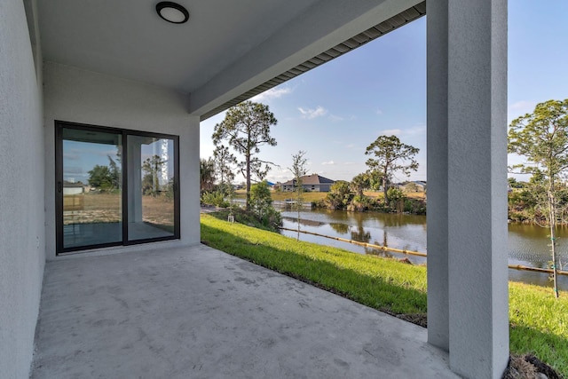 view of patio featuring a water view