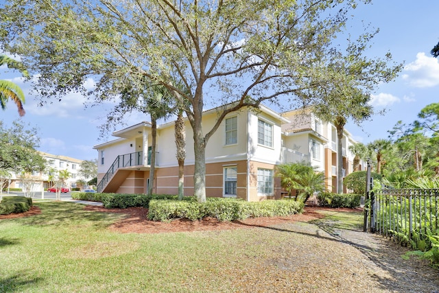 view of side of home featuring a lawn