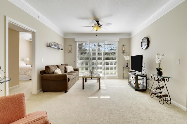 carpeted living room featuring crown molding and ceiling fan