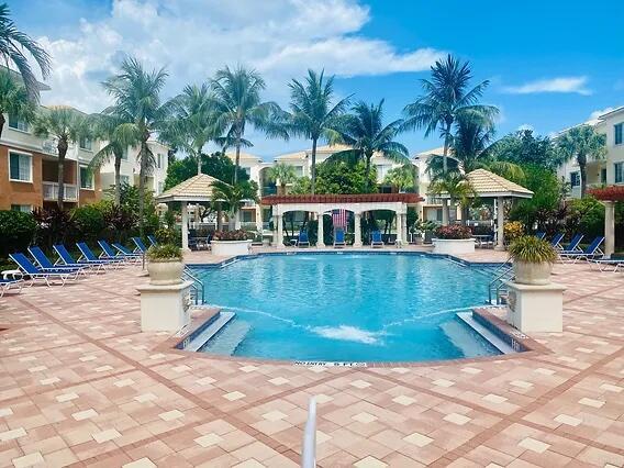 view of swimming pool with a gazebo and a patio