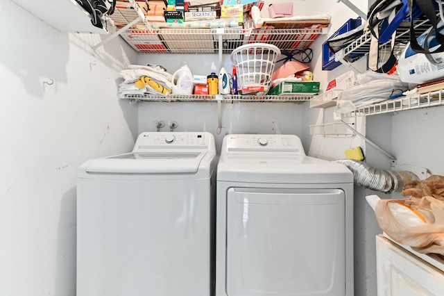 laundry room featuring separate washer and dryer