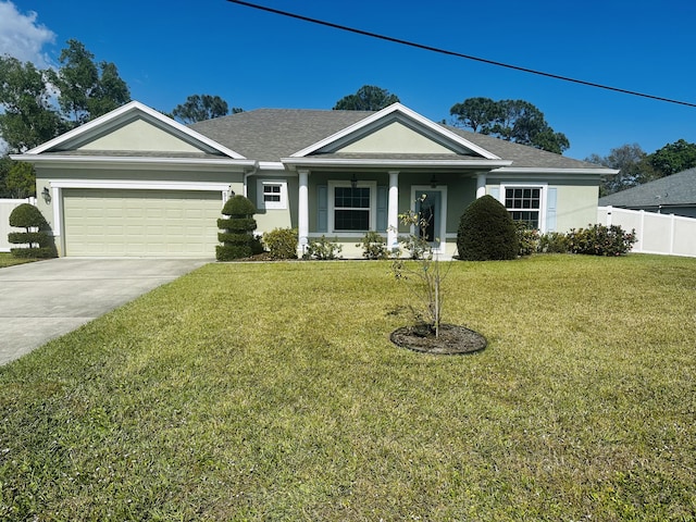 view of front of house featuring a garage and a front lawn