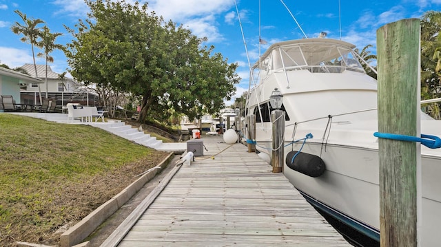 view of dock with a yard