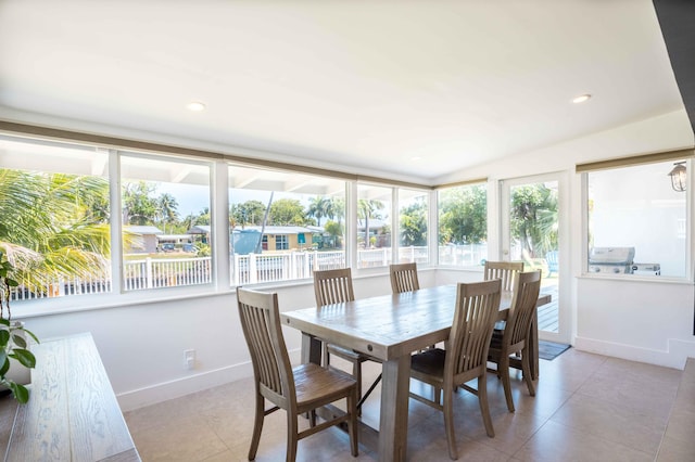 dining area featuring a healthy amount of sunlight and light tile patterned flooring