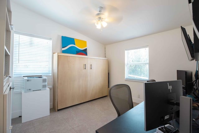 office area featuring lofted ceiling, cooling unit, and ceiling fan