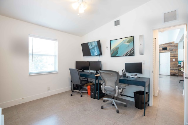 tiled office featuring lofted ceiling and ceiling fan