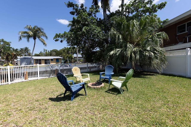 view of yard with a fire pit