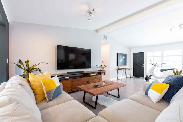 living room featuring lofted ceiling with beams