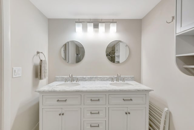 full bath with double vanity and a sink