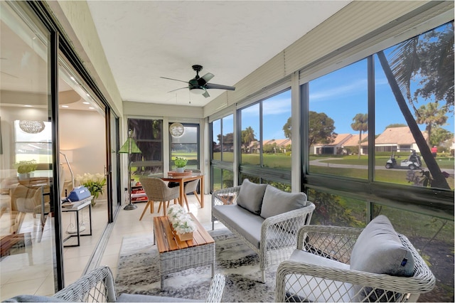 sunroom / solarium with a ceiling fan