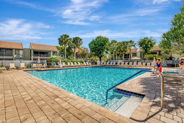 pool featuring a patio and fence