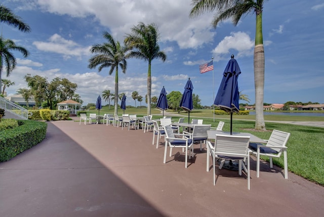 5659 Fairway Park Dr Unit 101, Boynton Beach, FL 33437 - view of patio / terrace featuring outdoor dining area and a water view