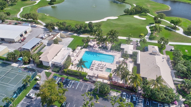 aerial view featuring view of golf course and a water view