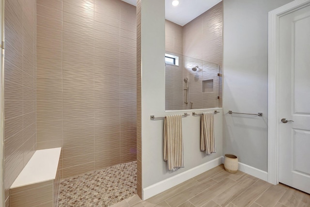 bathroom with a tile shower